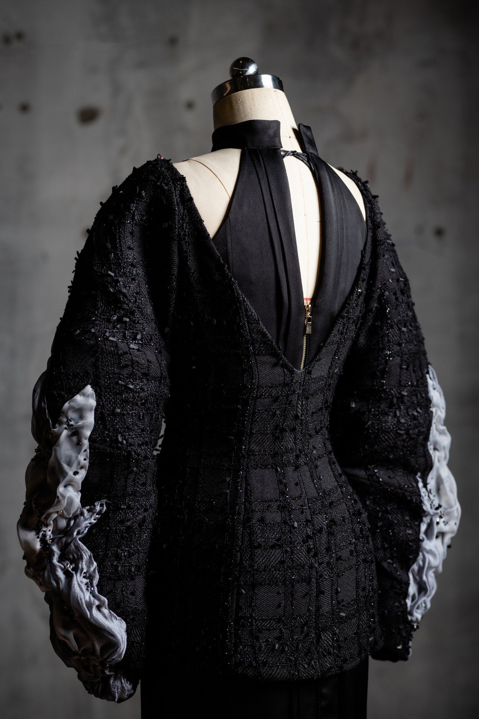 The Inner Faces jacket from behind, showing the layered sleeve construction
