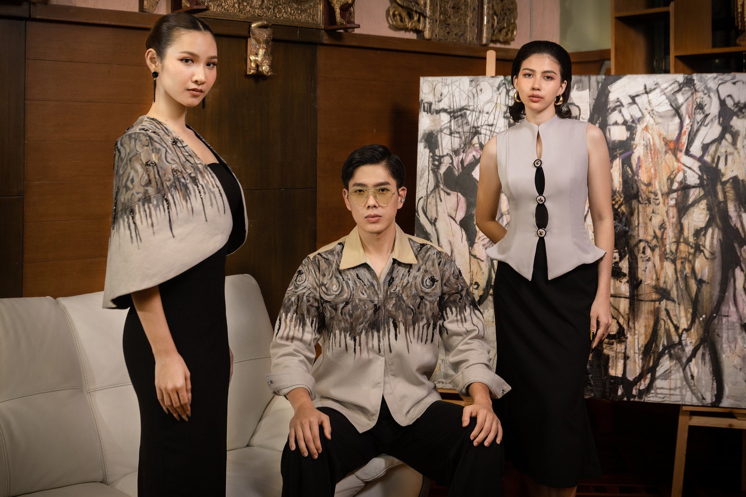 Three looks from The Hope Collection photographed in front of the paintings that inspired them
