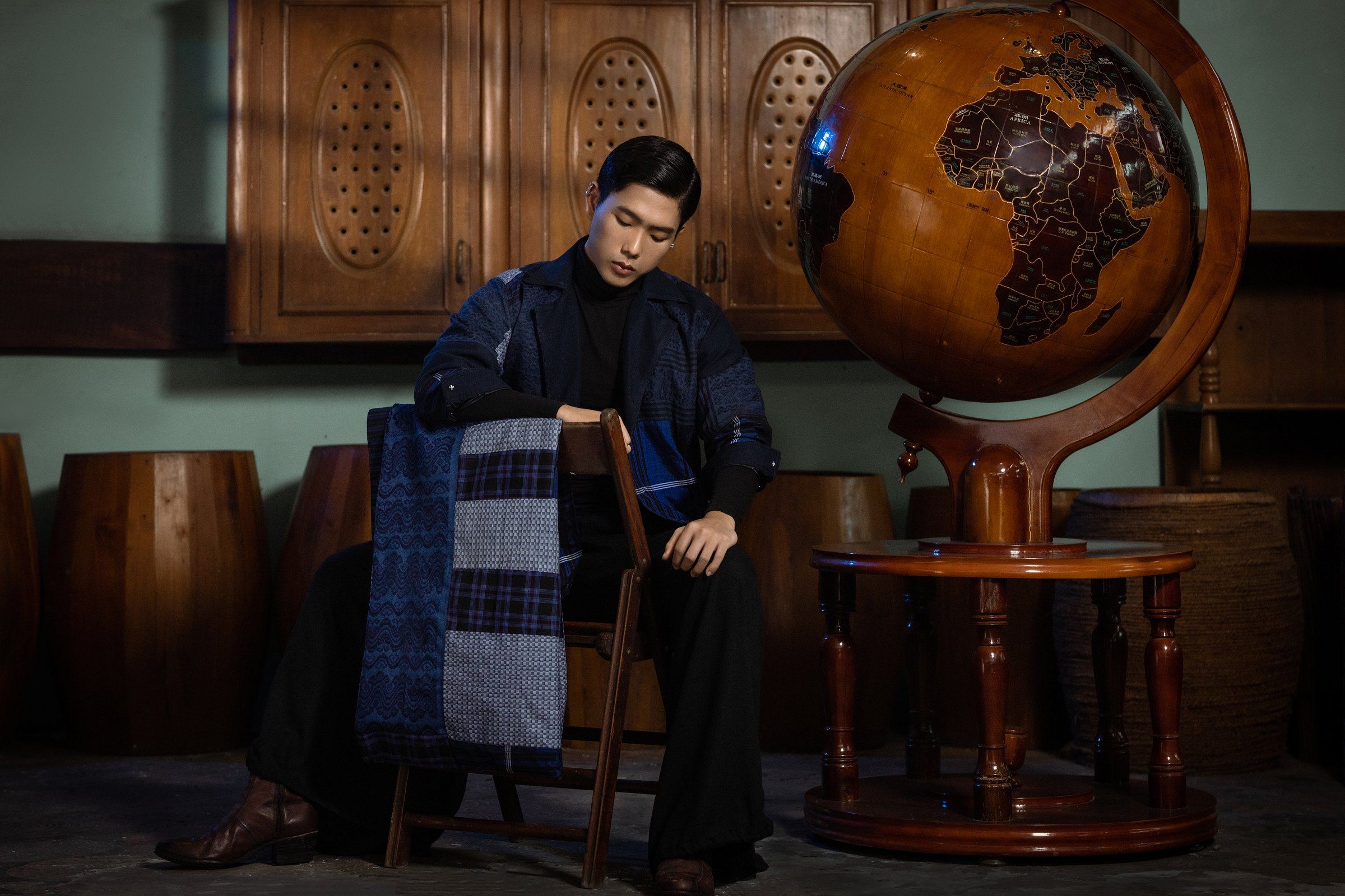 A patchwork coat and scarf from New Traditional, seated